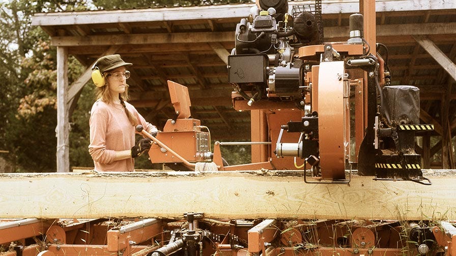Megan Offner of New York Heartwoods sawing on a portable band sawmill